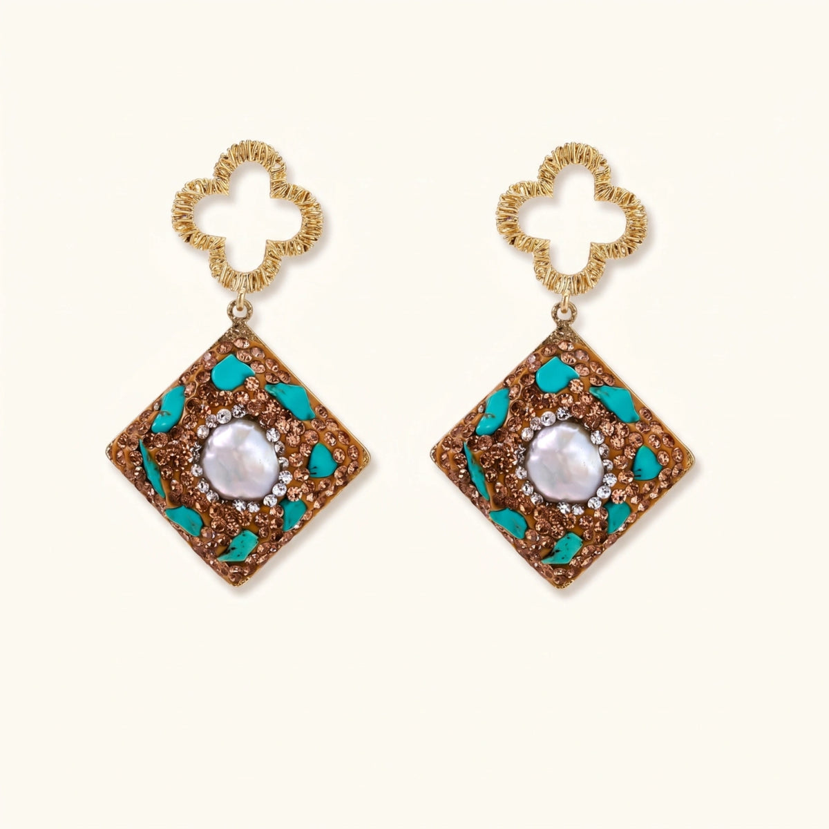 Gold-plated drop earrings with quatrefoil studs, diamond-shaped pendants featuring baroque pearls, turquoise stones, and amber crystals