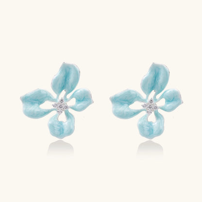 Turquoise enamel flower stud earrings with marbled finish and crystal centers on 18K gold plated brass