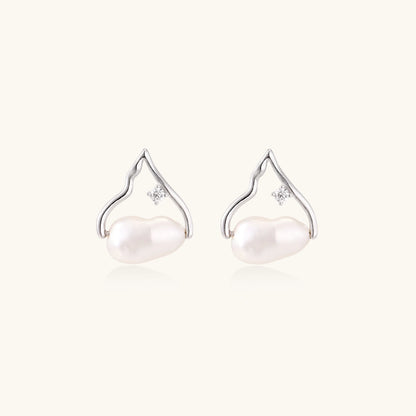Silver mountain outline studs with baroque pearl and diamond accent on white background