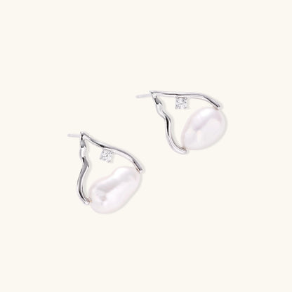Silver mountain outline studs with baroque pearl and diamond accent on white background