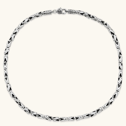 Men's antique silver Byzantine chain necklace, 6.2mm wide interlocking S-link pattern with ornate lobster clasp, 560mm length.
