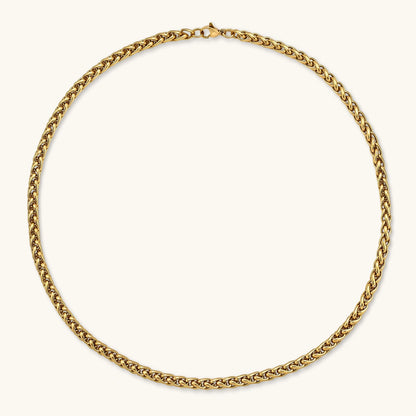 18K gold-plated stainless steel wheat chain necklace, 4.2mm wide, with lobster clasp, on off-white background.